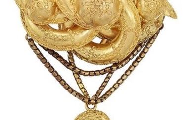 A mid 19th century gold brooch, the scrolling...