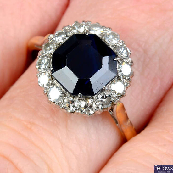 A mid 20th century platinum and 18ct gold sapphire and single-cut diamond cluster ring.