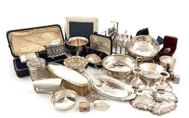 A mixed lot of silver items, various dates and makers, comprising: two toast racks, a pair of Norwegian dwarf candlesticks, a two-handled bowl, a pair of pierced bonbon dishes, four ashtrays/dishes, a continental tea strainer on an English stand, a...