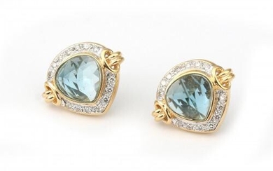 A pair of 18 karat gold topaz and diamond ear studs. Featuring a pear cut blue topaz surrounded by brilliant cut diamonds, ca. 0.40 ct. in total. Gross weight: 9.3 g.