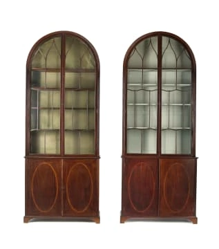 A pair of George III style inlaid mahogany cabinets