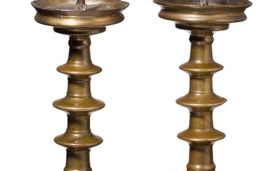 A pair of German disc candlesticks, 16th century