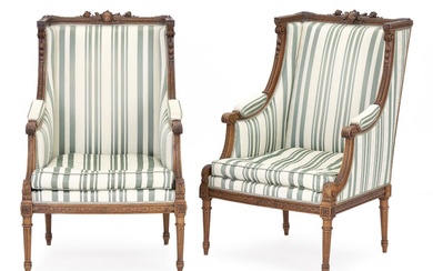 A pair of Louis XVI style mahognay bérgeres. 20th century. (2)