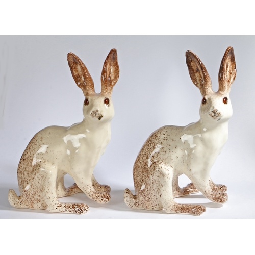 A pair of 'Winstanley' pottery Hares, signed to underside, 3...