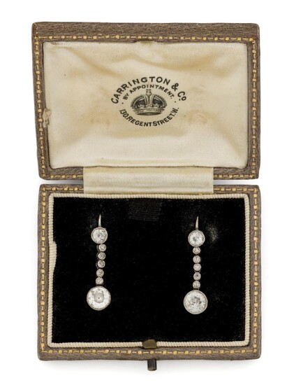 A pair of early 20th century, diamond drop earrings, each composed of a single millegrain-set brilliant-cut diamond drop, diamond weighing approximately 0.50 carats, to an old-brilliant-cut diamond suspension with diamond five stone articulated...