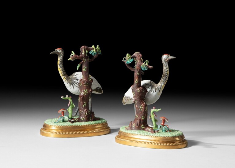 A pair of gilt-bronze mounted Chinese porcelain cranes, the porcelain Qianlong (1736-1795), the mounts Louis XV style | Paire de grues en porcelaine de Chine d’époque Qianlong (1736-1795) et monture de bronze doré de style Louis XV , A pair of...
