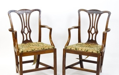 A pair of late 18thC fruitwood elbow chairs with Chippendale...