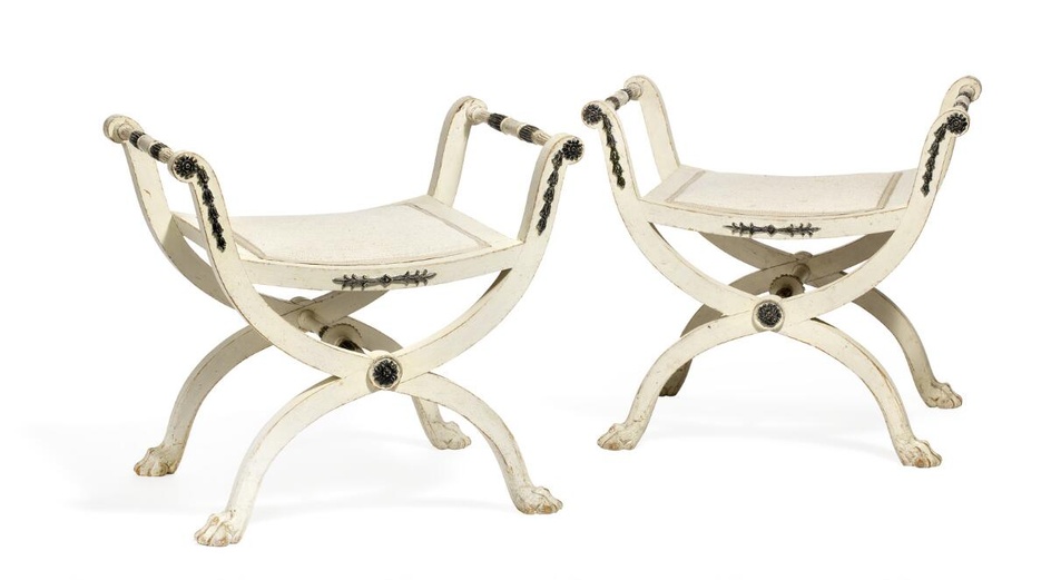A pair of late Gustavian painted stools with X-shaped legs joined by...