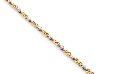 A pearl and diamond bracelet set with five natural pearls and brilliant-cut diamonds weighing a total of app. 0.80 ct., mounted in 18k gold and white gold.