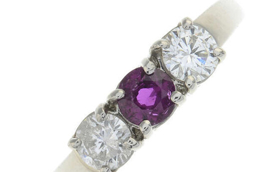 A platinum ruby and brilliant-cut diamond three-stone ring.