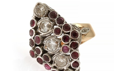 A ruby and diamond ring set with numerous circular-cut rubies and five brilliant-cut diamonds, mounted in 14k gold and white gold. Size 57.