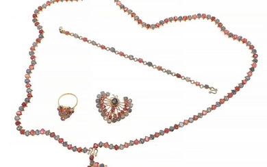 A ruby and sapphire jewellery collection comprising a necklace, a bracelet, two brooches and a ring each set with numerous rubies and sapphire, mounted in silve