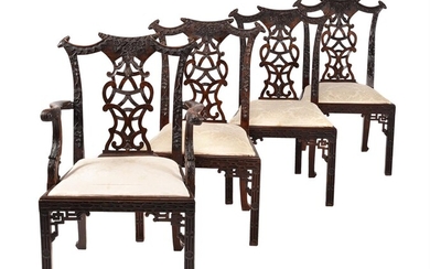 A set of eight carved hardwood dining chairs in George III style