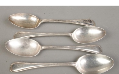 A set of four early Twentieth Century silver table spoons, b...