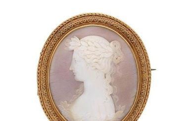 A shell cameo brooch, oval shaped with a central shell cameo depicting a young lady with a wreath in