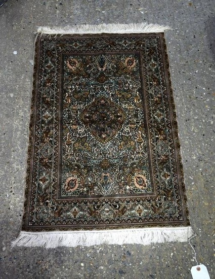 A small silk rug. 92 x 61cm.