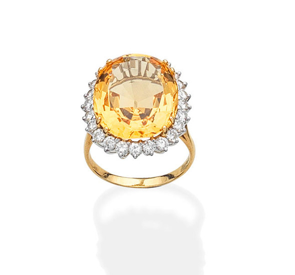 A topaz and diamond ring