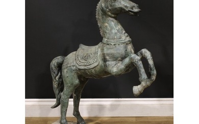 A verdigris patinated garden bronze, cast as a Chinese Tang ...