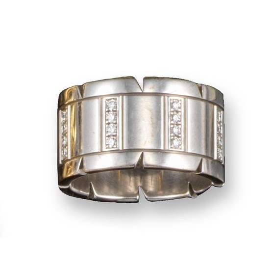 A white gold and diamond tank track ring...