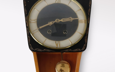 A wooden wall clock, 20th century.