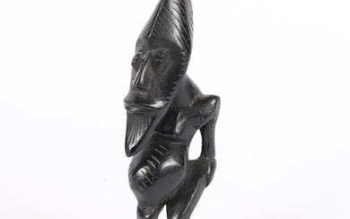 AN AFRICAN CARVED HARDWOOD FIGURE.