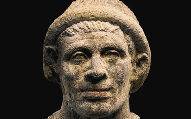 AN ETRUSCAN NENFRO PORTRAIT HEAD OF A MAN, LATE 2ND/EARLY 1ST CENTURY B.C.