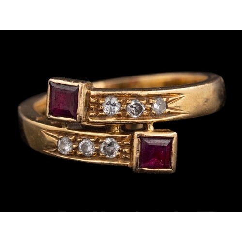 An 18 carat gold, ruby and diamond ring:, the crossover ring...