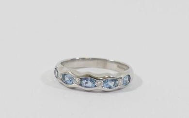 An 18 carat white gold aquamarine and diamond half eternity ...