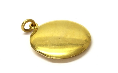 An 18ct gold circular locket