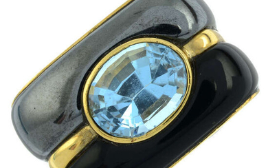 An 18ct gold hematite, onyx and blue topaz dress ring, by Ming's.