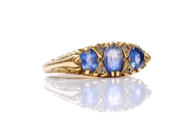 An 18ct sapphire and diamond seven stone ring in the Edwardi...