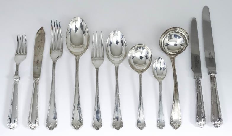 An Elizabeth II Silver Table Service for Eight Place...