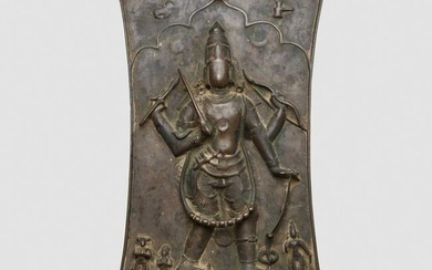 An Indian bronze shield-form plaque depicting