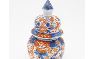 An Oriental ginger jar decorated in the Imari palette with f...
