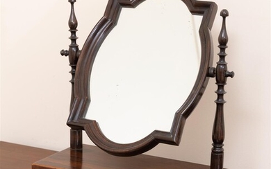 An antique rosewood dressing table swing mirror with shaped top...