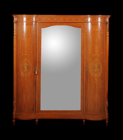 An early 20th century French satinwood and inlaid wardrobe