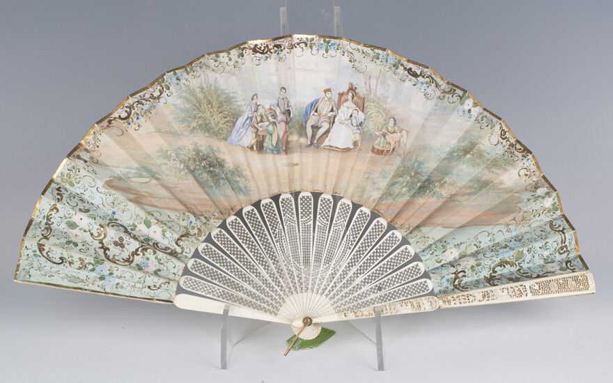 An early/mid-19th century Canton ivory and painted paper folding fan, the two guards finely carved w