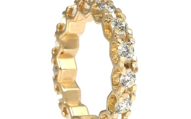 An eternity diamond ring set with numerous brilliant-cut diamonds weighing a total...