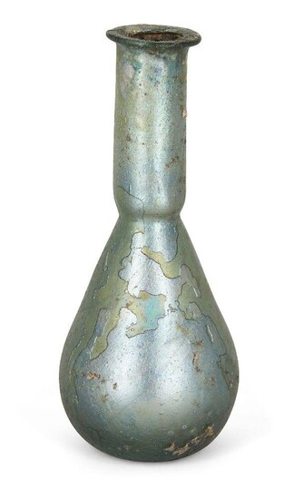 An intact Roman greenish-blue glass perfume bottle, 4th century AD, of globular form with a tubular neck, 15.8cm. high Provenance: Purchased from Rabiraffi Ancient Art, 3 December 1981