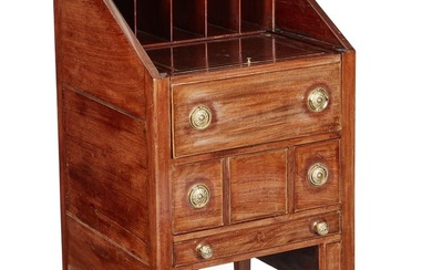 An unusual George III mahogany slant front desk