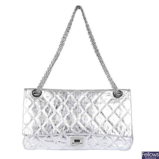CHANEL - a metallic silver quilted 2.55 Reissue Flap 228 handbag.