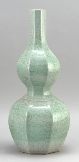 CHINESE CELADON PORCELAIN VASE In octagonal double gourd form, with a crane and trigrams design. Height 17.75".