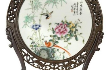 Circular porcelain plate depicting bamboo, birds, and