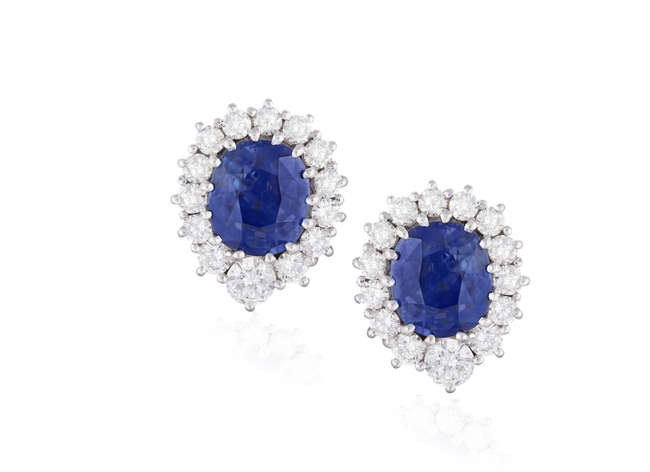 Description A PAIR OF SAPPHIRE AND DIAMOND CLUSTER EARRINGS...