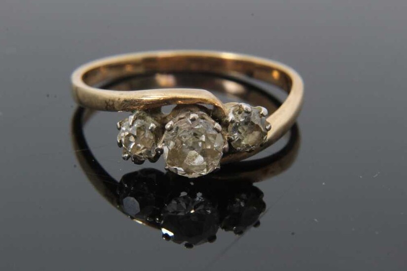 Diamond three stone ring with three old cut diamonds in cross-over claw setting on 9ct gold shank. Estimated total diamond weight approximately 0.65cts. Ring size O½