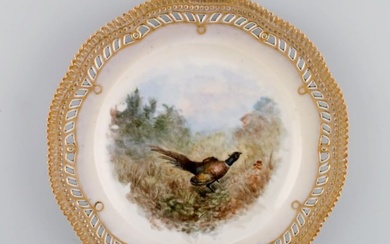 Early and rare Royal Copenhagen Fauna Danica plate in hand-painted porcelain with hunting motif and