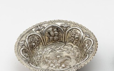 Fruit bowl with fruit relief. Round, deeply tilled...
