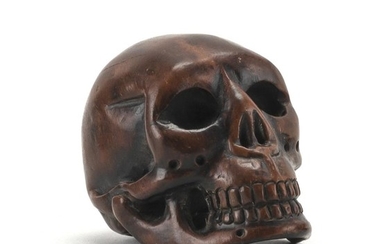 JAPANESE WOOD NETSUKE In the form of a skull. Length 2".