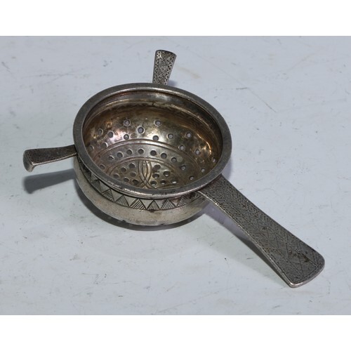 Liberty & Co - an Arts and Crafts silver tea strainer, 11.5c...