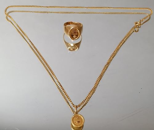 Lot of gold jewelry including a necklace and...